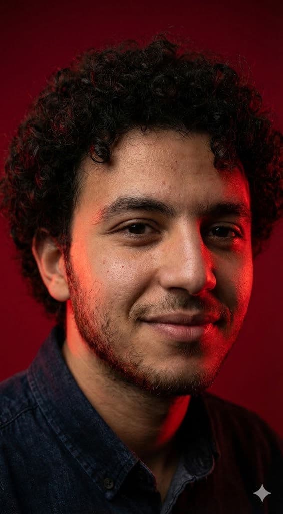 High-End Editorial Studio Portrait AI Prompt – Intense Red Reflections, Preserved Facial Features — Portrait AI art prompt example for Gemini and Stable Diffusion