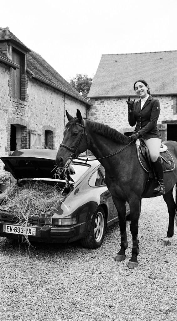 Surreal Black and White Lifestyle Prompt – Horse Eating Hay from Porsche 911 — Portrait AI art prompt example for Gemini and Stable Diffusion